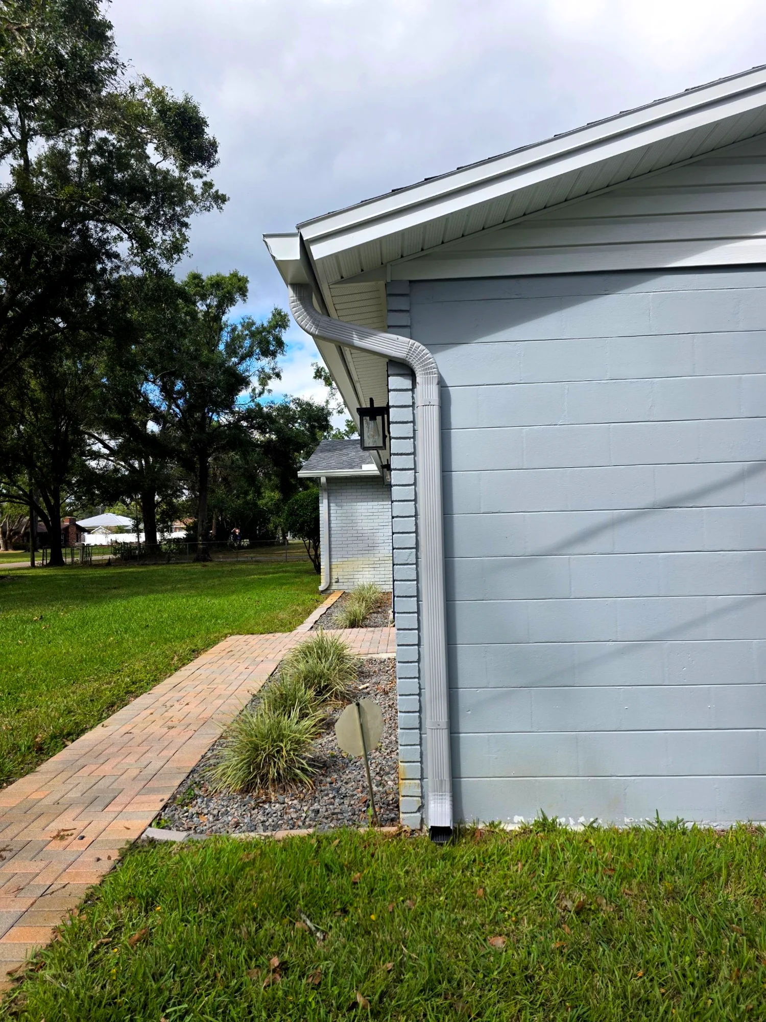 Downspout drainage connection on a Florida home