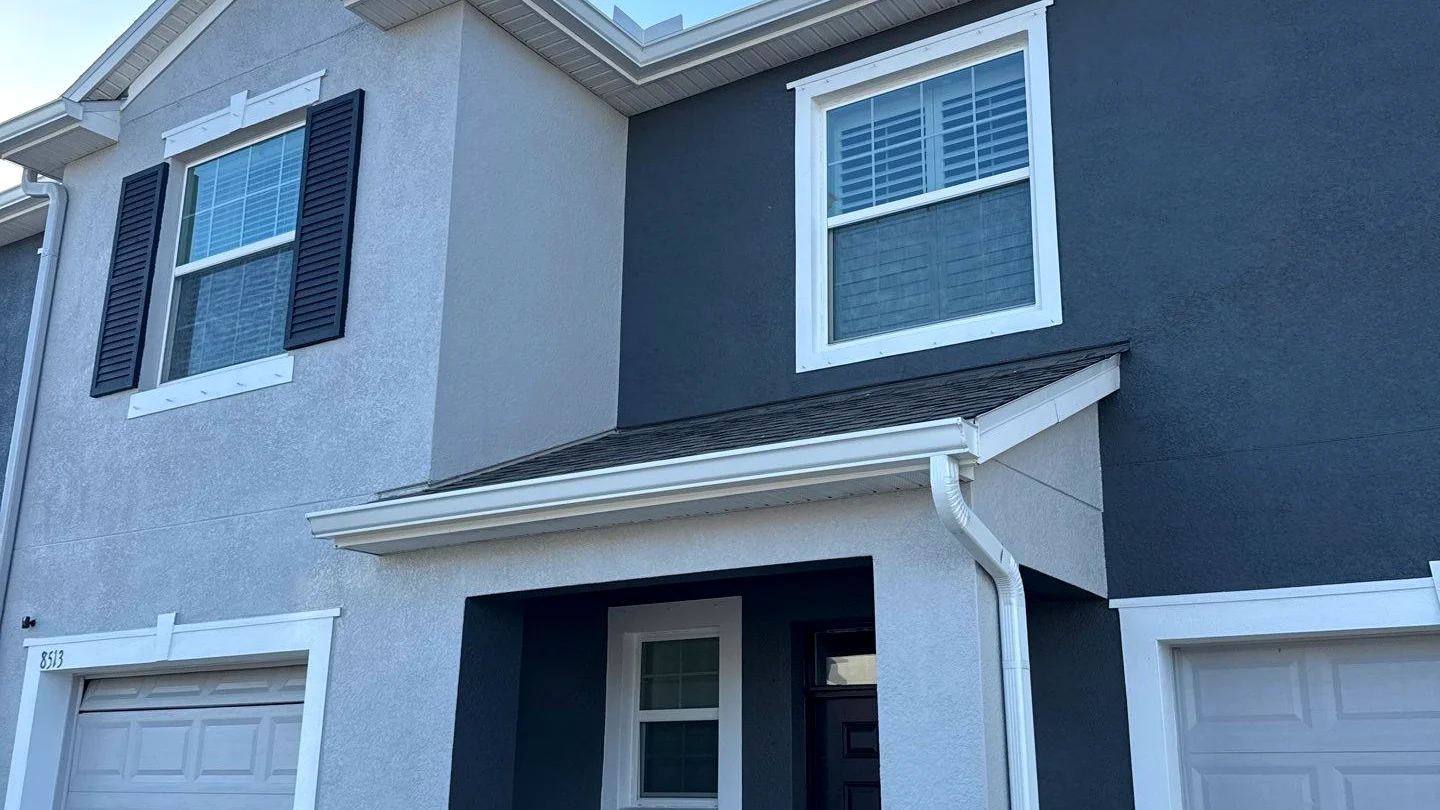 Townhome roofline with refreshed gutters and downspouts in Orlando
